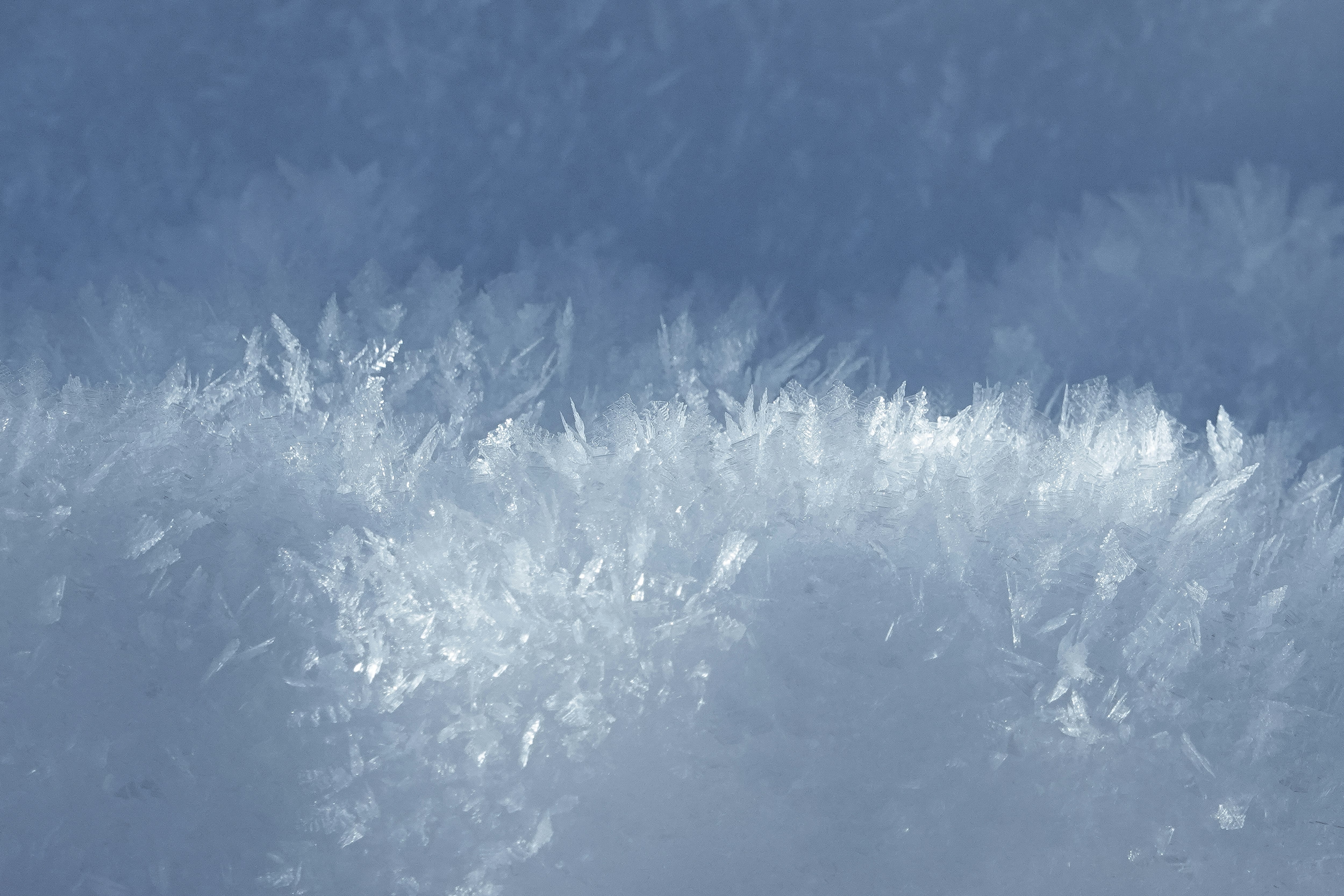 white snow on blue sky